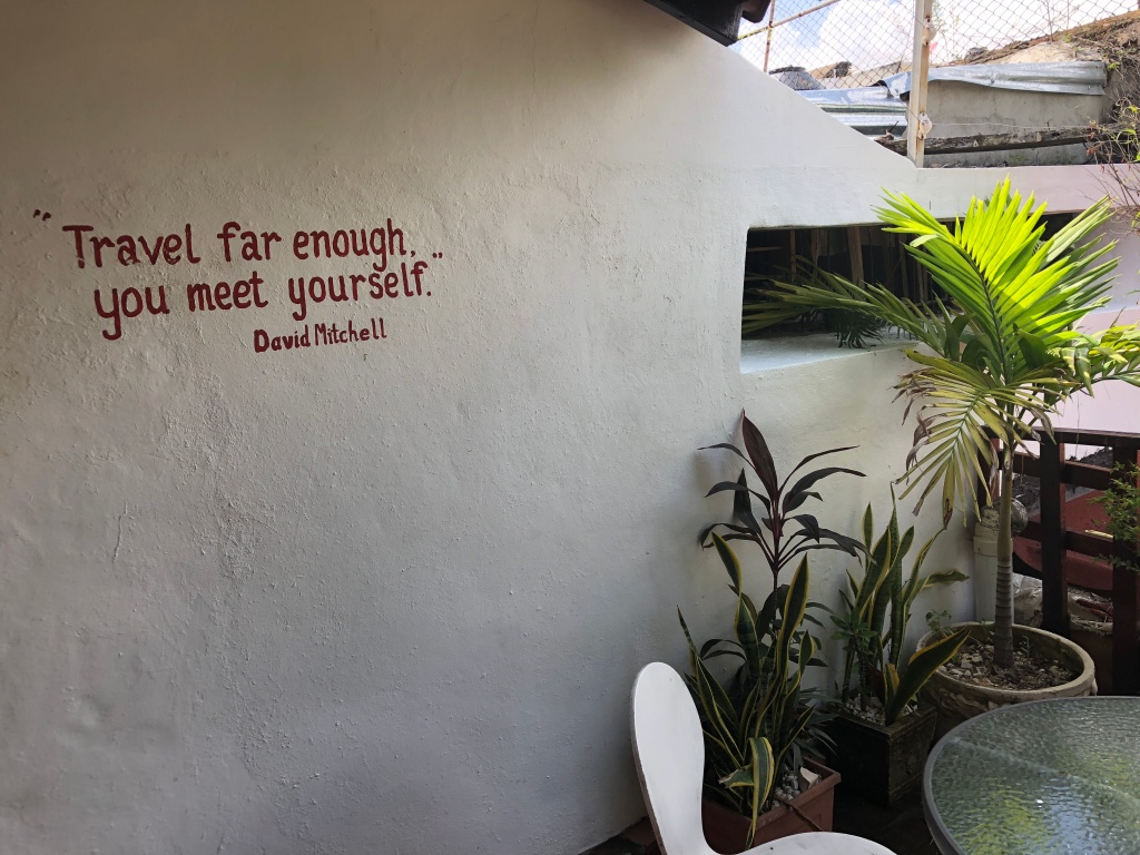 traveling quote on wall at hostel in Dominican Republic